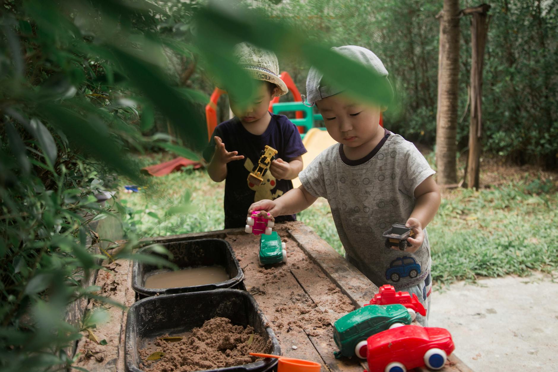 boys playing toy cars